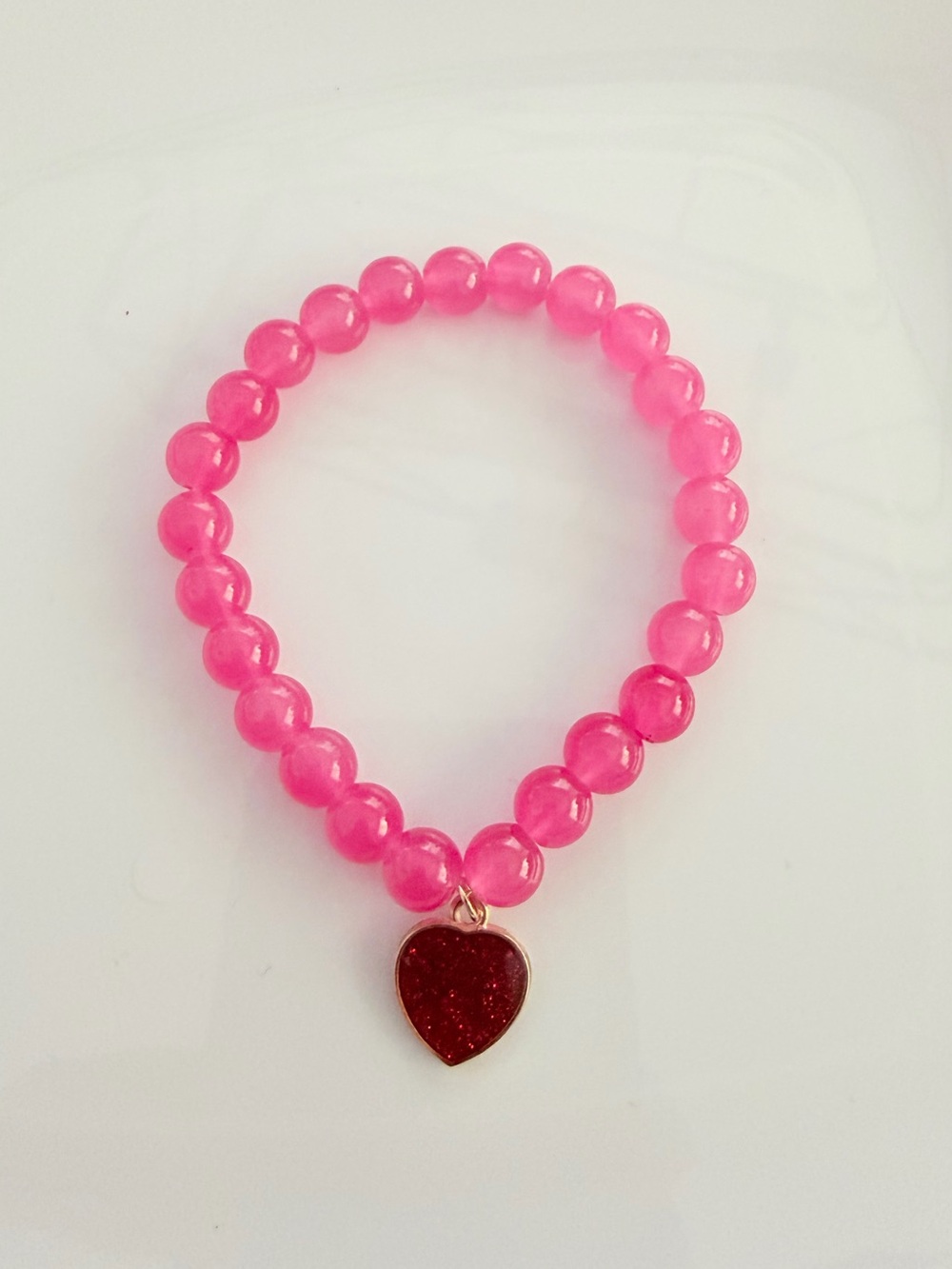 Pink Beaded Stretch Bracelet with Red Heart Charm